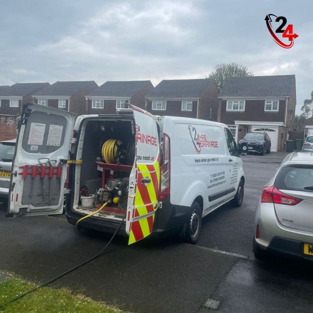 engineer unblocking a drain on an emergency call-out at a home