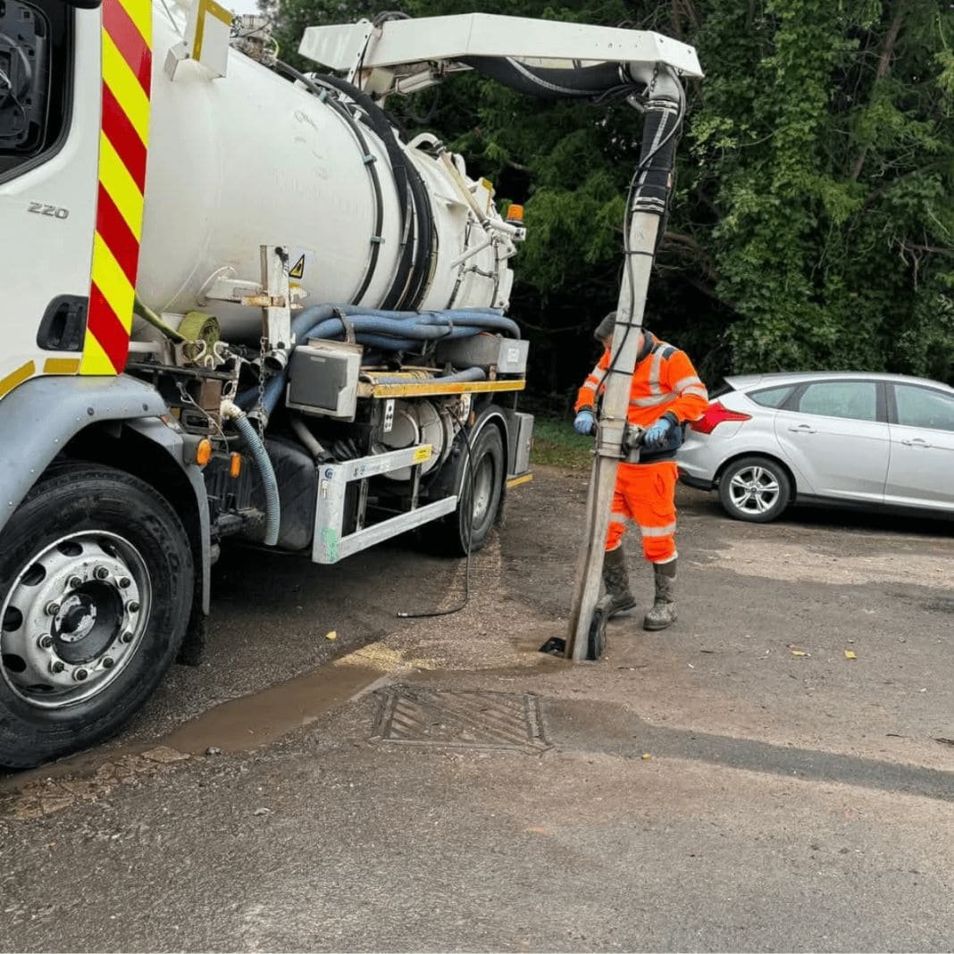 24hrs Drainage tanker vehicle completing drainage work on the road
